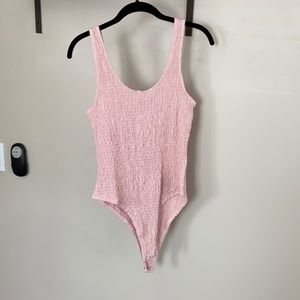 Pink body suit